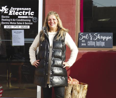 AMBER JASA, who operates Sal’s Shoppe’s St. Paul location, is pictured in front of the boutique’s Sixth Street storefront. Photos by Michael Rother