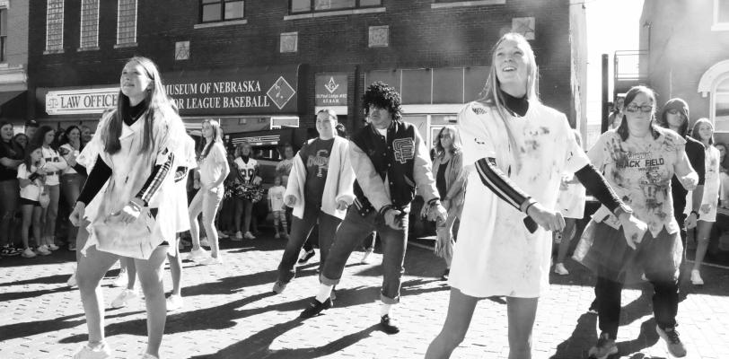 A FLASH MOB made an appearance at Friday’s homecoming pep rally in downtown St. Paul. St. Paul Head Volleyball Coach Matt Koehn-Fairbanks led the group in a performance of Michael Jackson’s “Thriller.” Photo by Michael Rother