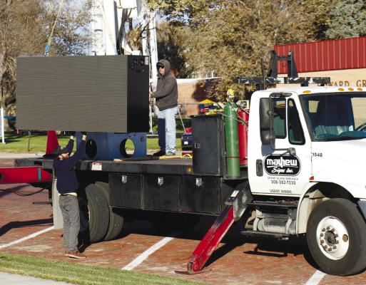 WORKERS with Mayhew Signs of Grand Island installed a new Skyline sign at the St. Paul Civic Center earlier this month. Photo by Haley Spotanski