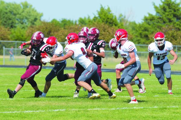 CENTURA’S Quentin Morris attempts to pick up some yards during the second quarter of Friday night’s game. (Michael Happ)