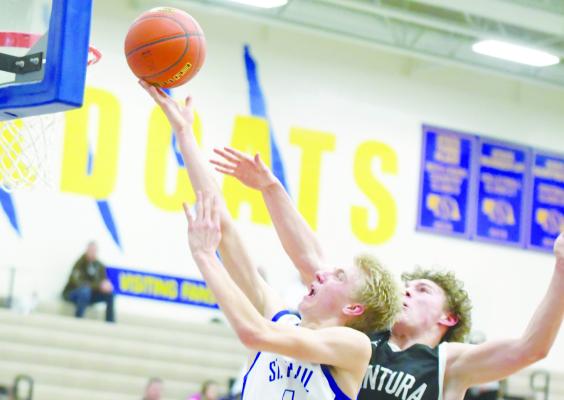ST. PAUL’S SAM WELLS reaches for the rim during the waning minutes of last week’s cross-country rivalry game against Centura. Wells had a game-high twenty-three points in the contest. Photo by Michael Happ