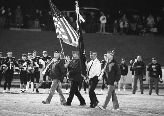 REPRESENTATIVES of the Wolbach and Greeley American Legion posts and Sons of the American Legion assisted in presenting the colors prior to Friday night’s quarterfinal football game between Central Valley High School and Archangels Catholic High School. Presenting the colors were Luke Thompson, Jordan Foltz, Pat Harvey, and Ash Allen. Photo by Michael Happ