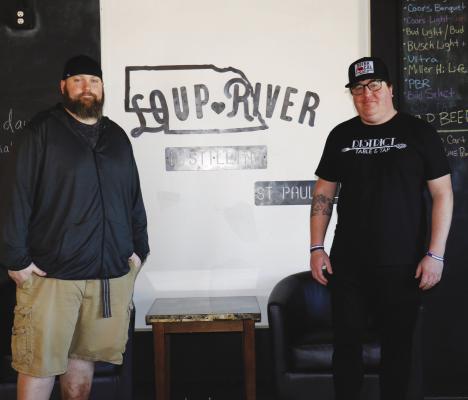 SEVEN COUNTY SPIRITS, LLC Co-owner and Operations Manager Andrew McCarthy (right) and Seven County Spirits, LLC General Manager Brandon Kluender (left) are pictured inside the distillery in St. Paul. (Michael Rother)