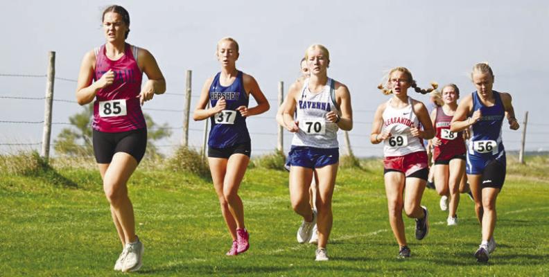 KATIE KLEINSASSER battles for position on Thursday at the Ravenna Invitational. Kleinsasser placed forty-eighth at the Bluejays’ meet. Photos by Michael Happ