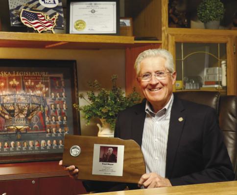 NEBRASKA STATE SENATOR FRED MEYER poses with a plaque he received in recognition of his “two years of public service to the Nebraska Unicameral Legislature.” Meyer was appointed twice to serve District 41, as part of the 108th and 109th legislatures. Photo by Michael Rother