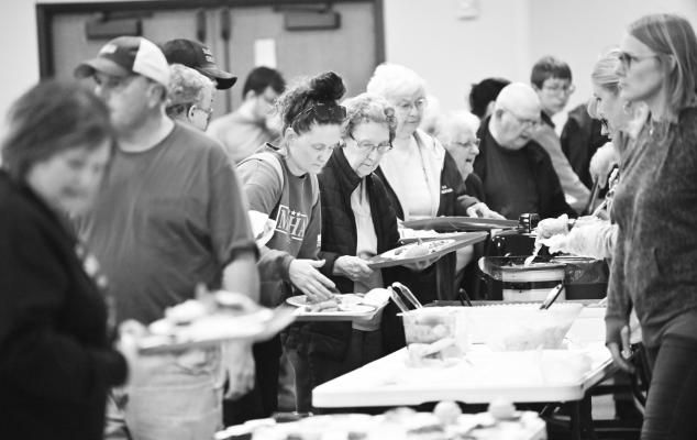 THE KNIGHTS OF COLUMBUS AND COUNCIL OF CATHOLIC WOMEN at Sts. Peter and Paul Catholic Church in St. Paul held their second of three Friday Night Lenten Fish Fries this past week. A large crowd attended the event at the Sts. Peter and Paul Catholic Church Parish Life Center, with proceeds going to benefit the two sponsoring organizations’ various group service projects. Photo by Michael Happ