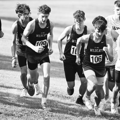 RUNNERS on the St. Paul boys’ cross country team, including Tate Busch, Aiden Lukasiewicz, Lorenzo Giarnetti, and Eli Sladek, take off at the start of last week’s race in Ravenna. Photo by Michael Happ