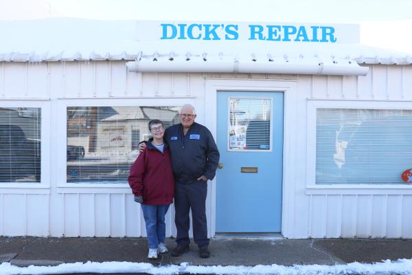 DICK’S REPAIR owners Betty and Richard “Dick” Czarnek are pictured outside of their repair shop on Seventh Street in St. Paul. The St. Paul couple sold the shop early last month. (Michael Rother)