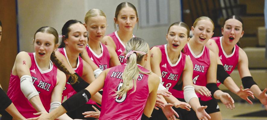 MEMBERS of the St. Paul High School girls’ volleyball team dawned pink last Tuesday, during the Wildcats’ match against Doniphan-Trumball, as a part of the district’s annual Pink Out event for National Breast Cancer Awareness Month. The match featured a variety of festivities, including Senior Night and Parents Night celebrations. Photo by Michael Happ