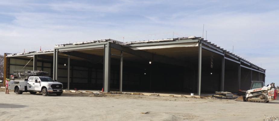 HOME PLATE MARKET, the future site of St. Paul’s grocery store, continued to see progress early this week. Crews with Chief Construction have made use of the warm weather to continue the work of enclosing the roughly 16,500-square-foot building. The north and west sides of the building were enclosed as of Monday. Photo by Michael Rother