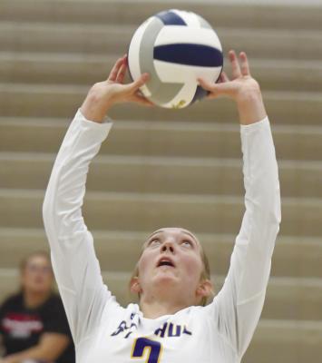 NATALIE POSS sets the ball during a match earlier this month. Poss had twenty-three set assists last week. File Photo