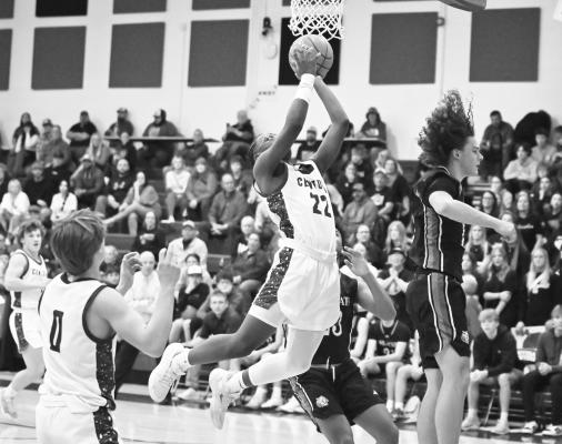 IAN KAPUNDA rises towards the iron during the first quarter of last Tuesday night’s game against St. Paul. The Centurions battled past the Wildcats 44-38 in the regular-season bout. Photos by Michael Happ