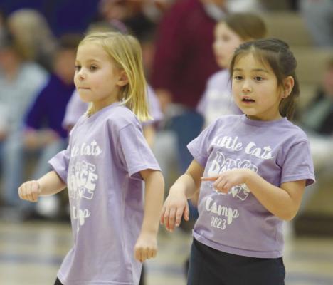 CECE MILLER AND KEIRA RENSCH dance to the music during the Little Cats Dance Camp last Tuesday night.