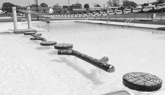 THE ST. PAUL WATER PARK will open this Friday with refurbished and repaired floaties and new edge pads, thanks to the city’s Keno funds. Waterpark Excitement, of Texas, had repaired two sets of the floaties, one dating back “probably ten years” and another dating back to the start of the water park in 2002. Each set contains four log slices and two logs, with the older set to serve as a backup. The total cost of the repairs and new pads had been reportedly around $20,000. Courtesy Photo