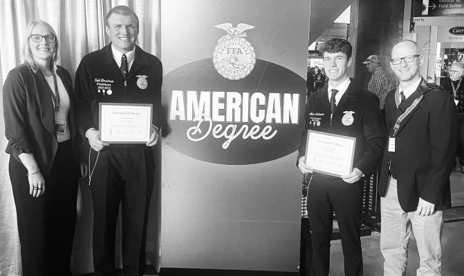 ST. PAUL FFA CHAPTER members Zach Hirschman and Aidan Anderson are pictured with their American FFA degrees at the National FFA Convention. Five other students received the degree but were not on hand. They included Ahna Jerabek, John Placke, Max Swanson, Nate Jameson, and Nick Busse. Also pictured are advisers Tara Sjuts and Boyd Bowder. Courtesy Photo