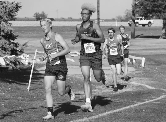 CHRISTOPHER THOMAS heads into the final straightaway during last week’s district meet in Hastings. Thomas placed forty-third at last Thursday’s competition. (Michael Happ)