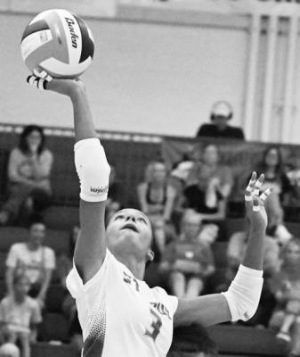 ZAYA LEWIS passes the ball over the net during the first set of last week’s match against Ord. Lewis had six kills in the match. Photo by Michael Happ