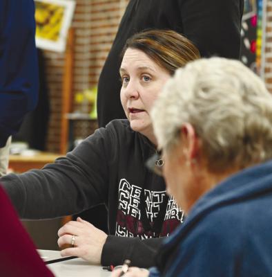 CENTURA Board of Education President Sandra Davis looks over the plans for the proposed facility improvements at Centura Public Schools last week. Photo by Michael Happ