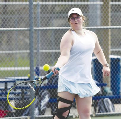 MADISON HARRAHILL makes a pass during last week’s tennis dual in Kearney. Photo by Jordan Coslor