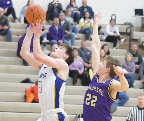 ST. PAUL’S ESPEN GOETTSCHE goes to the rim during the second half of Friday night’s game against Holdrege. Goettsche had twelve points in last week’s contest. (Michael Happ)