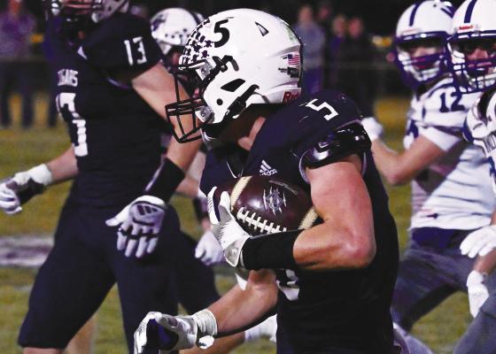 LUKE SHOEMAKER sprints to the outside of Central Valley’s offense during Friday night’s semifinal game against Wynot at Memorial Field. Shoemaker was a key part of the Cougars’ offense during last week’s game against the Blue Devils. Photos by Michael Happ
