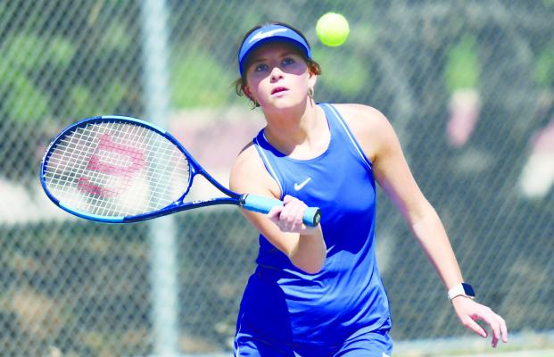 AUDRA DUGAN was among the Wildcat tennis team members who battled in third doubles against Hershey last Tuesday at the Holdrege Triangular. Dugan and her partner, MaKenzie Shreve, lost the match 8-4. Photos by Jordan Coslor