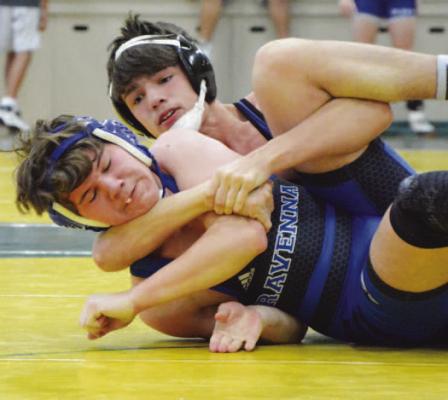 BRYSON THOMSEN works to pin Mason Wendt of Ravenna during the Wildcats’ dual with the Bluejays on Saturday. Thomsen locked up Wendt in the second period. (Monte Steele)