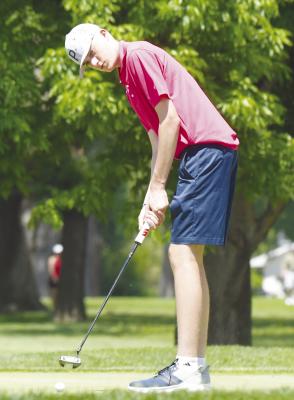 MADDOX QUINN watches his putt on the ninth green during last week’s state tournament in Columbus.