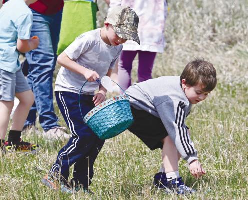 EAGER HUNTERS plowed through the pastures on Sunday afternoon at the Broedy Starkey Memorial Easter Egg Hunt northeast of Cushing. It was estimated that between 450 and 500 people attended this year’s hunt. Photos by Michael Happ
