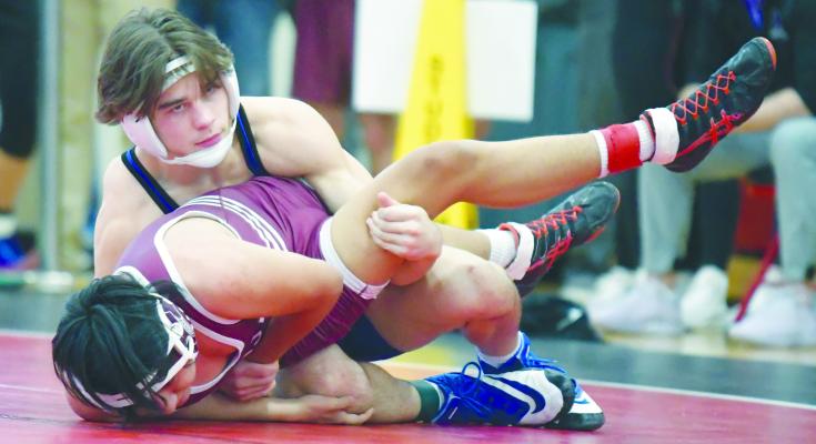 ALEX MEINECKE pinned Wakefield’s Andy Manjarrez in the first period of Meinecke’s opening round match at 157-pounds on Saturday. The sophomore finished the day as the district champion with a 41-1 record. Photos by Michael Happ