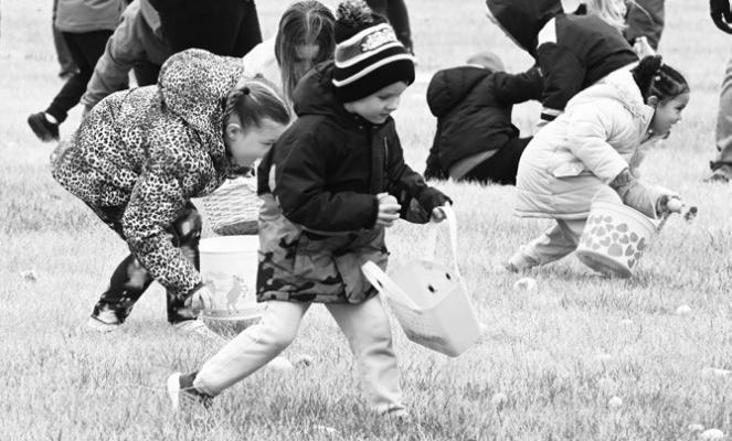 AREA CHILDREN had plenty of room to run during the St. Paul Area Chamber of Commerce’s annual Easter egg hunt. This year’s hunt was held on the campus of Brookefield Park Skilled Nursing and Rehabilitation in St. Paul on Saturday morning. The new location was due to the ongoing park improvement project in the St. Paul City Park. Photo by Michael Happ