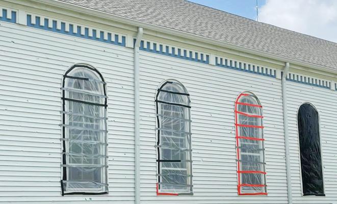 WINDOWS on the north side of St. Anthony of Padua Catholic Church in Farwell were damaged on Saturday evening following a severe storm that moved through the area. Large hailstones broke many of the exterior storm windows on the north side of the building and also, in several cases, caused damage to the protected windows on the interior. (Courtesy Photos)