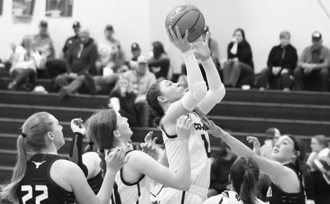 CENTRAL VALLEY’S Alexis Johnson drives into the lane during the second half of last Thursday night’s game against Burwell. The Longhorns limited the Cougars’ inside looks in Burwell’s 31-30 victory. Photos by Michael Happ