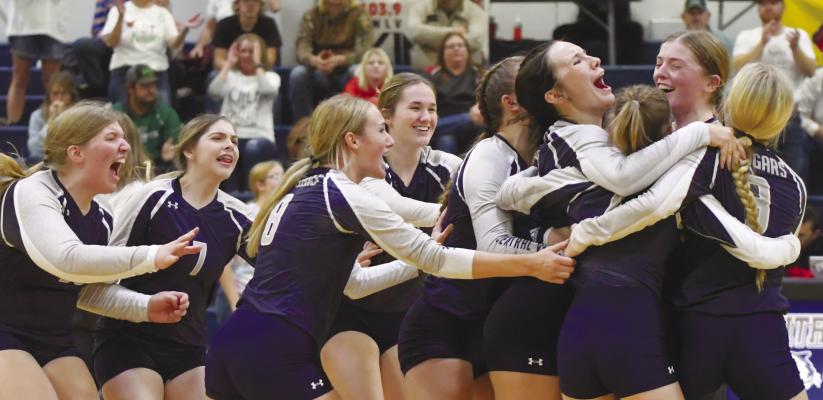 MEMBERS of the Central Valley volleyball team celebrate following match point during Saturday evening’s District D2-8 Championship match between the Cougars and the Knights from Sandhills/Thedford. Photos by Michael Happ