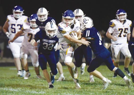 QUARTERBACK ZANDYN WELLER attempts to slip from the grasp of the Cougars’ defense on Friday night. Weller is the fourth Wildcat to take snaps for St. Paul this season. Photo by Michael Happ