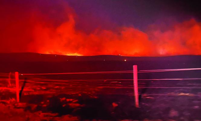 NINE AREA VOLUNTEER FIRE DEPARTMENTS battled a grassland fire southeast of St. Paul on Sunday evening. It was estimated that around eighty-five volunteers helped fight the blaze, and thirty-five apparatus were on scene. (Courtesy Photo)