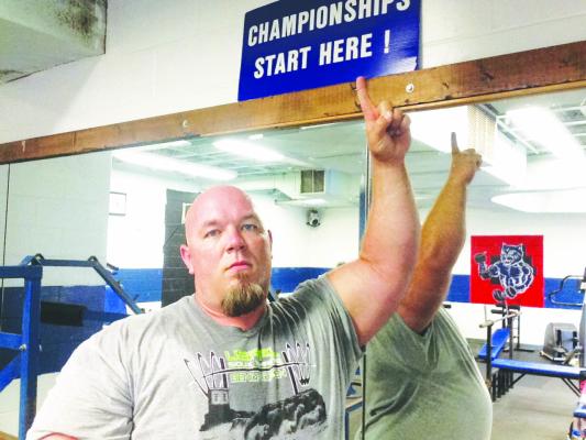 JONA LEO, a 1995 graduate of St. Paul High School, was inducted into the USA Powerlifting Men’s Hall of Fame earlier this year. Leo is pictured in the weight room at St. Paul High School during a past visit to his alma mater. (Courtesy Photo)