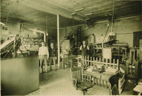 AROUND 1929 The Phonograph’s office was located at the rear of the old Citizens National Bank building. Publisher, Dan Webster, is on the far right, and his son, Laverne Webster, who became publisher in 1934, is on the left. The person in the background could not be identified. (File Photo)
