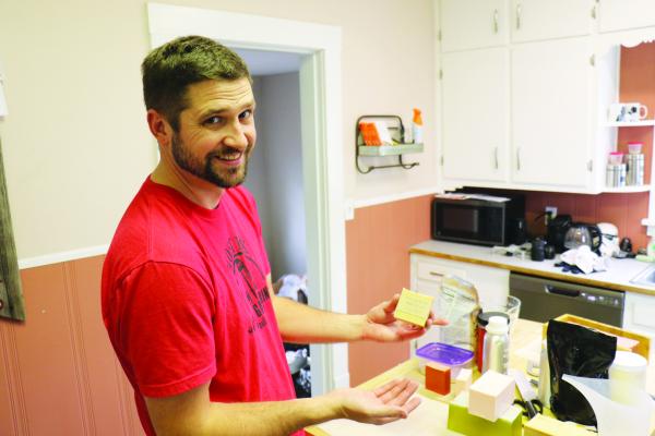 SHOWING OFF his Rustic Wood soap during an interview last week was Jordan Sokol of St. Paul. Sokol started making soap earlier this year, saying he was looking for something fun to do during the winter. (Michael Rother)