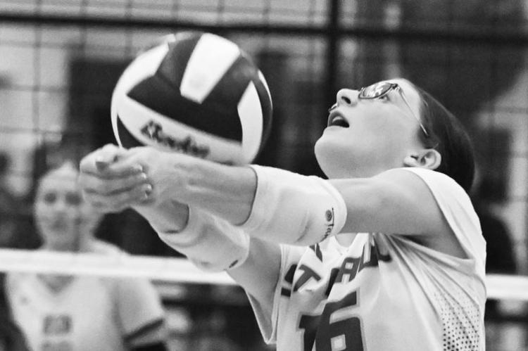 ST. PAUL’S LAYTON LUKASIEWICZ passes the ball during the third set of last Tuesday’s match between the Wildcats and the Central City Bison. Photos by Michael Happ
