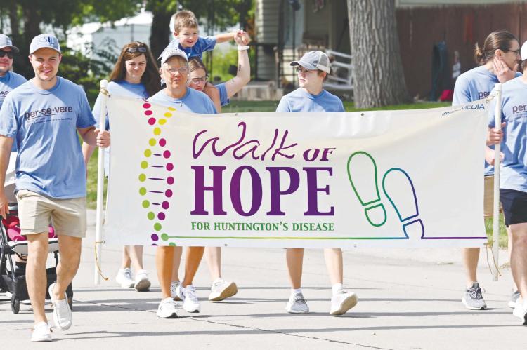 THE TWELFTH ANNUAL WALK OF HOPE for Huntington’s disease took to the streets of St. Paul on Saturday morning, marking the second time the event was held in Howard County. A large crowd participated in the event, which was held at the Sts. Peter and Paul Catholic Church Parish Life Center. Photo by Michael Happ