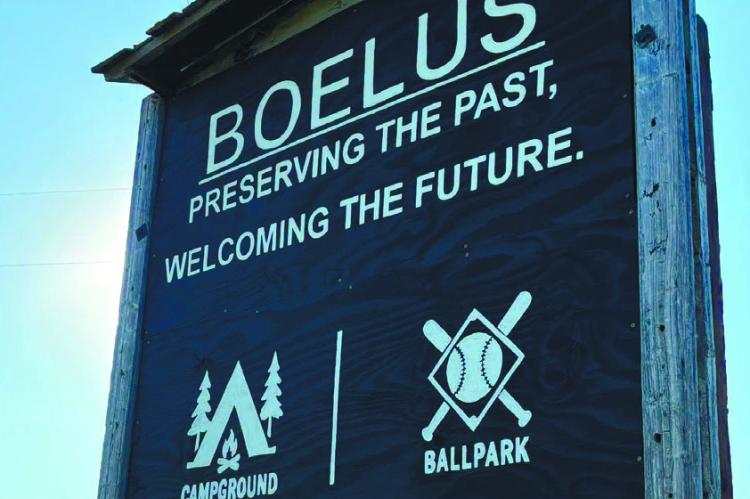 A NEW WELCOME SIGN was installed on the west side of Boelus on July 16th. Joan and Bob Kaputska, Cindy Bonczynski, and Russ Loomis had helped install the sign, which was created by Amanda Bonczynski. The installation follows a prior installation on the east side of town on July 13th of last year. Courtesy Photo