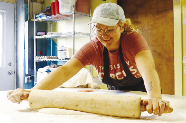 KELSIE WILSON, who owns The Danish Bakery alongside her husband, Justin, rolls out dough for fresh kolaches on a Friday morning at the longstanding Dannebrog establishment. Photos by Michael Rother