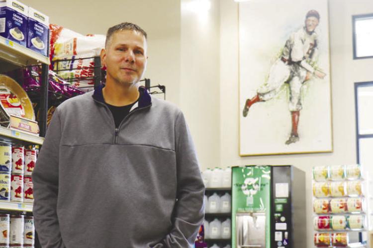 HOME PLATE MARKET Owner Blake Schwartz is pictured inside the new store on United States Route 281 in St. Paul. The new market had its soft opening on Tuesday. Photo by Michael Rother
