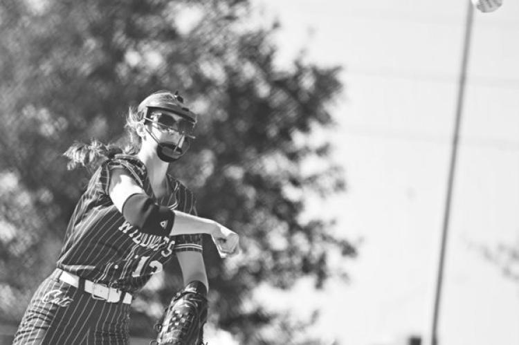 ANNIE STEPANEK makes a throw to first base for an out during Friday’s game against Central City. The Bison defeated the Wildcats 9-1 in the tournament’s consolation finals. Photos by Michael Happ