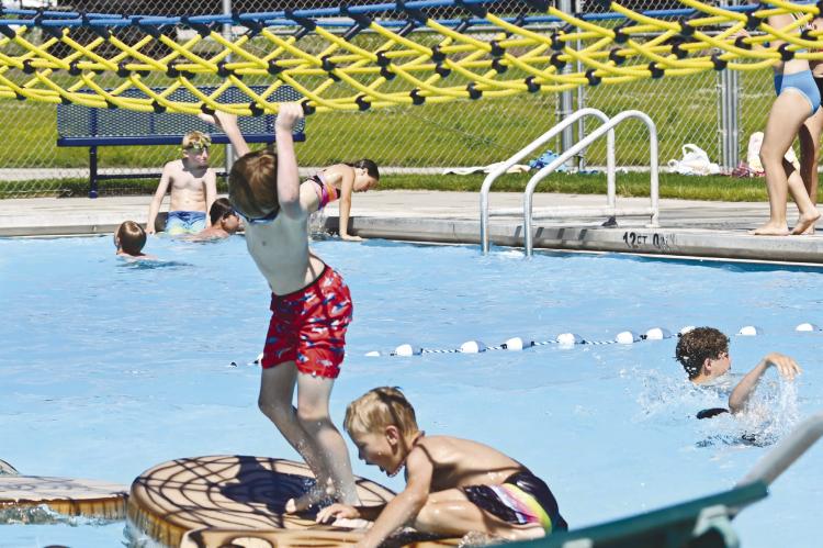 KIDS OF ALL AGES enjoyed the cool water at the St. Paul Swimming Pool on Sunday afternoon. The pool saw strong crowds during opening weekend lin May. Photos by Michael Happ