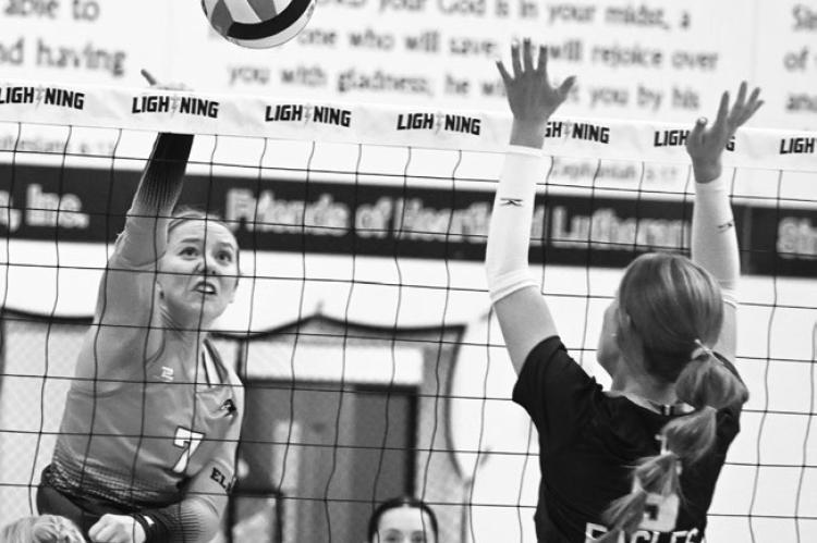 ADDISON WYSOCKI goes for the kill during the fourth set of Saturday’s consolation semifinal match against Nebraska Christian. Wysocki had thirteen kills against the Eagles. Photos by Michael Happ