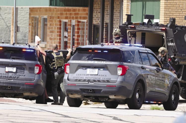 MEMBERS of Central Nebraska Special Response Team assisted the Howard County Sheriff’s Office in serving a search warrant at 704 7th Street on Sunday afternoon. Photos by Michael Happ