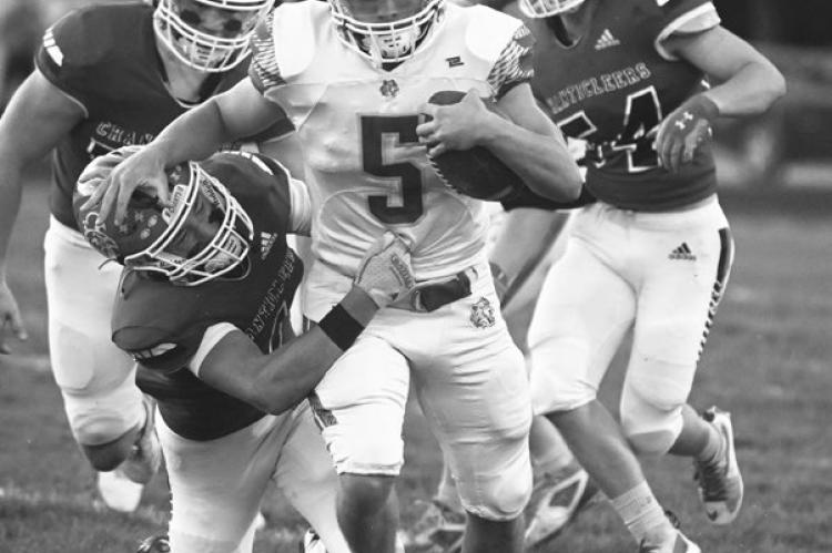 MASON MAJERUS breaks free for a forty-nine-yard touchdown carry during the third quarter of last Friday night’s football game between St. Paul and Ord. Photo by Michael Happ