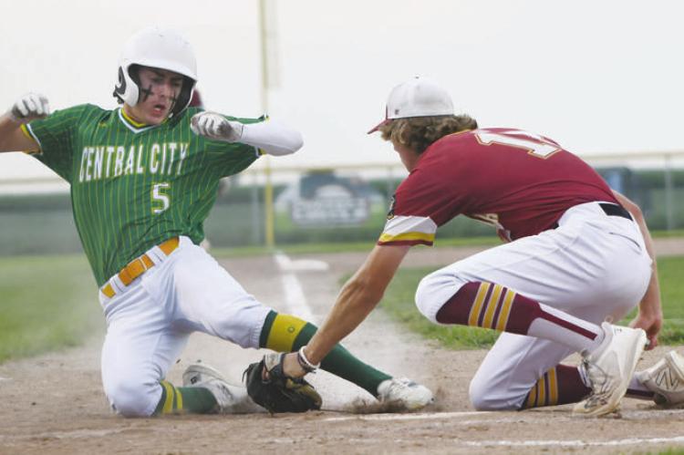 BARRETT FRIES tags out Central City’s Luke McHargue on a close play at the plate last Thursday. Fries pitched a complete game and led Centura with two hits in their 5-1 loss to Central City. Photos by Jordan Coslor
